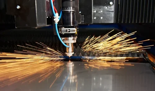 A Co2 laser cutting machine cutting through a sheet of acrylic with precision at https://laserwaterjetindia.com/